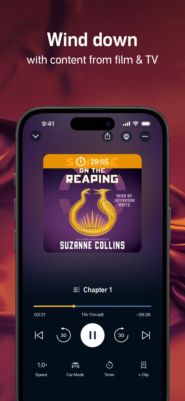 Audibleアプリのインターフェイスに、再生コントロールとスリープタイマーオプション付きのオーディオブックが再生されています。