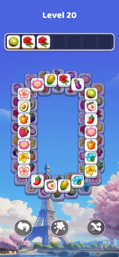Tile Explorer: Tiles Clear! - Users can explore diverse settings, like the iconic Eiffel Tower backdrop, while mastering classic match-3 mechanics with varied tile sets.