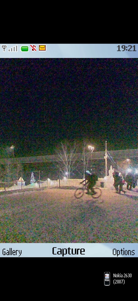 0.3MP Camera - Observe the app's capability to reproduce low-light photography with characteristic noise and banding artifacts, emulating the specific aesthetic of a "Nokia 2630 (2007)" camera.