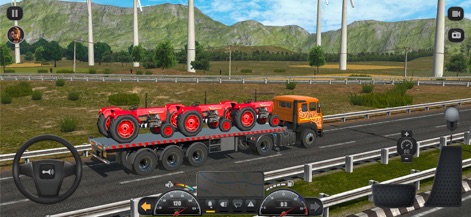 Truck Masters: India Simulator - Embark on an industrial journey with a specialized truck transporting multiple red tractors across an open highway, framed by majestic mountains and wind turbines.