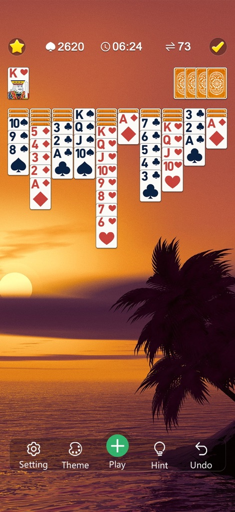 Classic Spider Solitaire Mania - The app allows players to personalize their game with vibrant themes like a serene sunset beach, alongside an array of distinctive custom card backs.