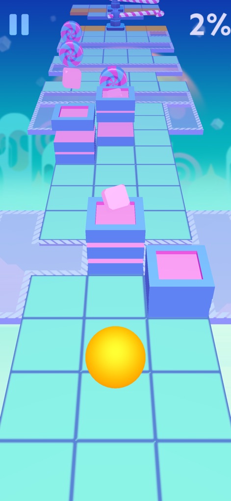 Rolling Sky - Les niveaux bonbons dévoilent des obstacles en forme de sucettes et des blocs pastel, offrant une expérience visuelle douce et entraînante.