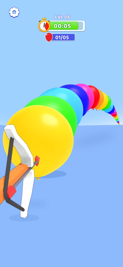 Crazy Challenge: Mini Games - O aplicativo desafia os jogadores a usar um estilingue posicionado para estourar uma fileira de balões vibrantes e multicoloridos.