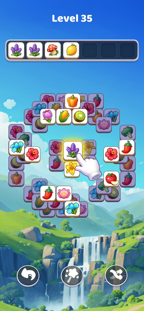 Tile Explorer: Tiles Clear! - Experience relaxing natural landscapes with cascading waterfalls while leveraging intuitive tile selection, highlighted by the guiding hand gesture.