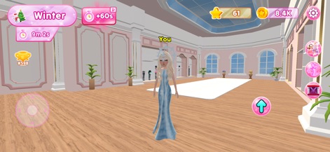Dress Up Fashion Star - This tool allows for the creation of intricate outfits, as seen on the character in an icy blue gown, set against a grand ballroom backdrop with expansive arched windows.