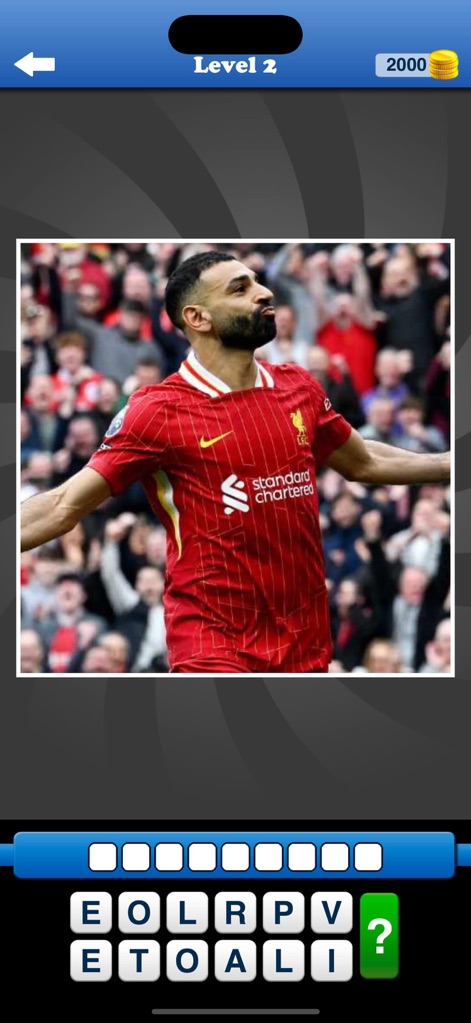 Whats the Team? Football Quiz - See how the app presents a player in their distinctive club kit and provides scrambled letter tiles for guessing.