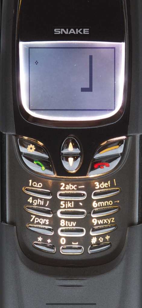 Snake '97: retro phone classic - This iteration presents a sleek phone model, highlighting its illuminated physical keypad and the crisp dot-matrix display for an immersive retro feel.