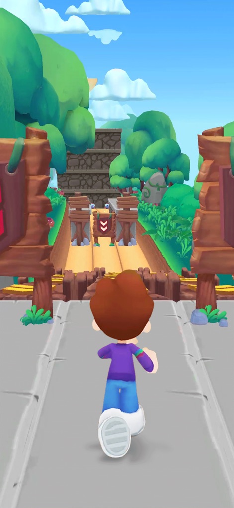 Kooply Run™: Play and Create! - Embark on an adventure through an Enchanted Forest, challenging users to navigate past sturdy wooden barriers within a lush green environment.