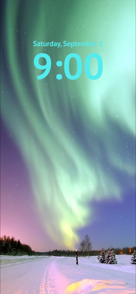 Wallpapers HD for iPhone! - ユーザーは、夜空を彩る神秘的なオーロラと、静寂な雪景色が融合した美しい壁紙をデバイスのロック画面に適用できます。